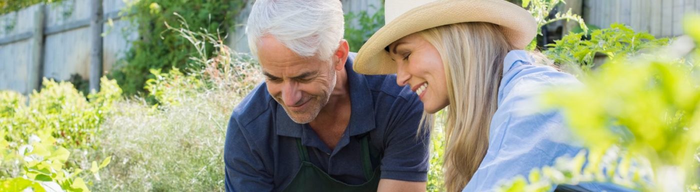 couple gardening discussing financial planning
